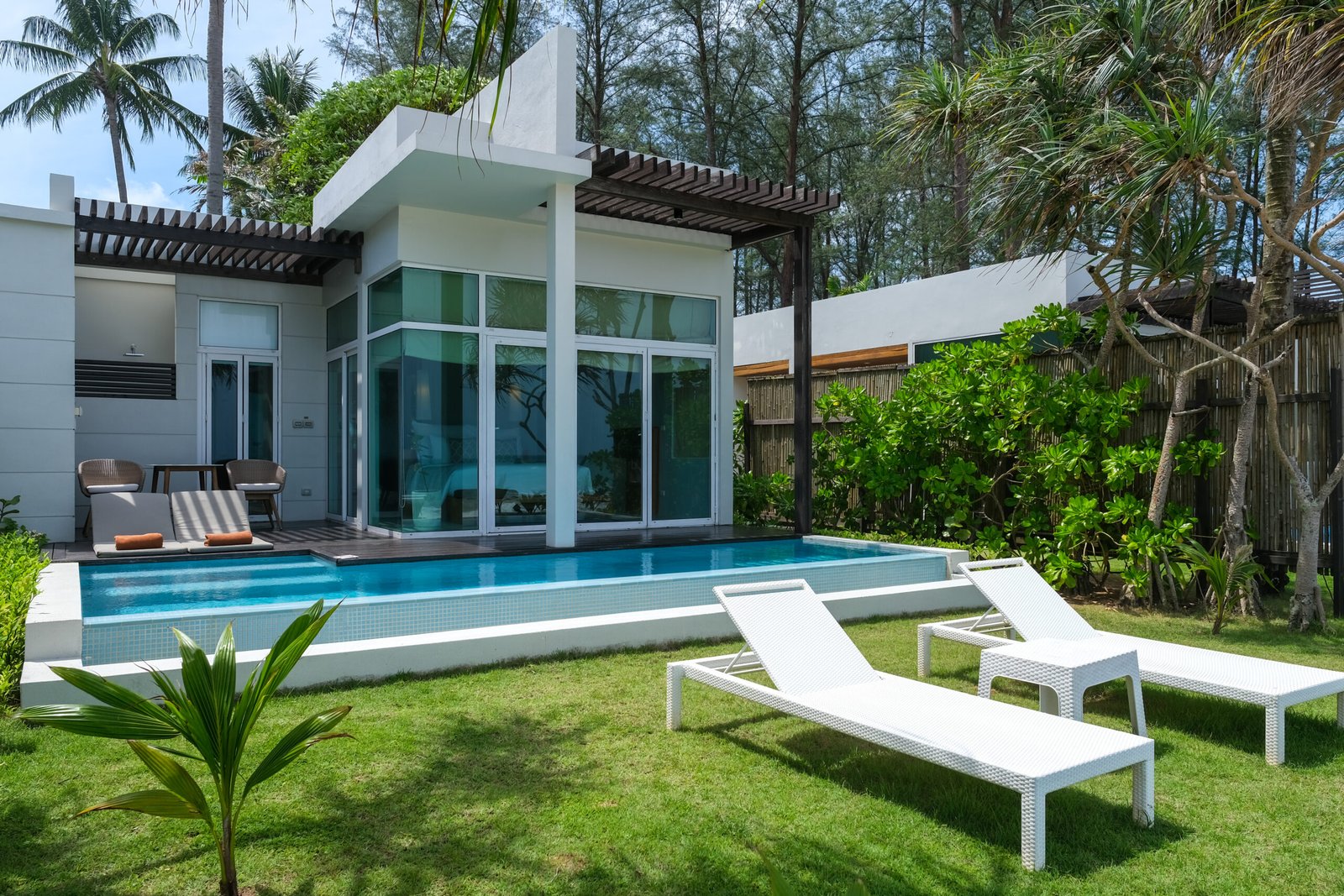 Modern house with a swimming pool, modern pool villa at the beach, luxury villa